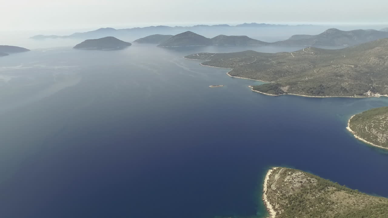 Flight over desert islands and colorful sea, Brijuni park, Croatia