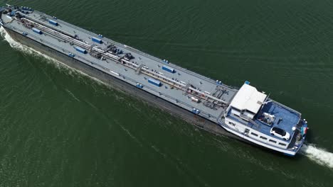 aerial view of a cargo ship sailing, peaceful and serene