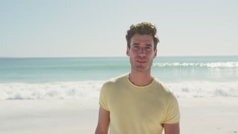 caucasian man looking at the camera at beach