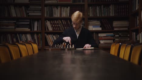 man playing chess in a library