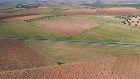 Landscape-with-a-road-with-cars-driving-from-a-drone-view