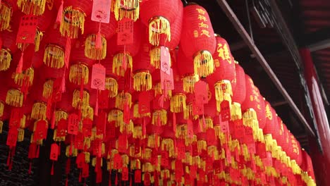 chinese lanterns hanging on the ceiling at buddhist temple