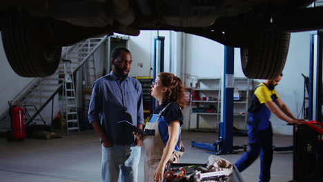 mechanic showing customer car changes