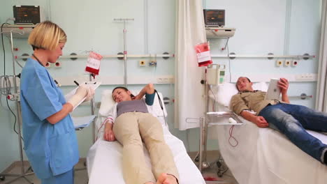 animation of white shapes over diverse doctor and patients in hospital