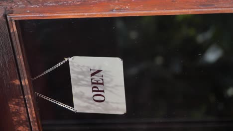 open sign on a glass door