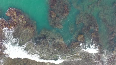 aerial view of rocky coastline with turquoise water
