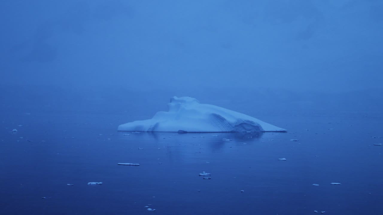 Iceberg at Night Floating in Ocean in Antarctica, Close Up Blue Iceberg in Dark Moody Scene in Antarctic Peninsula Sea Water in Winter Seascape, Iceberg Detail in Icy Scenery