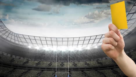 animation of referee holding yellow card on rugby pitch in sports stadium