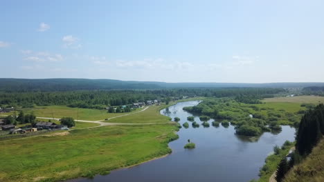 river winding through a village landscape