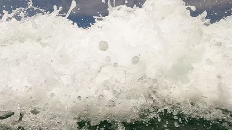 sea water surface pov of elderly bearded man having fun on summer holidays waiting big sea waves splashing on him