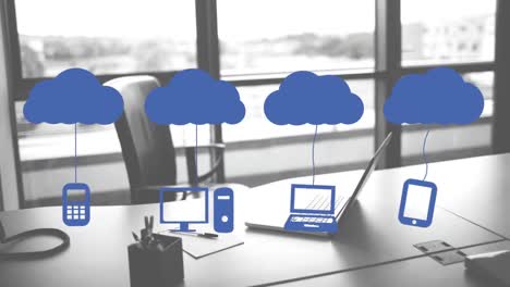 Animation-of-clouds-and-digital-icons-over-laptop-on-desk