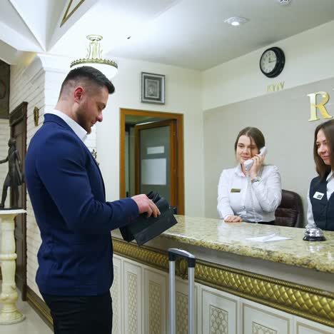 man at counter in hotel