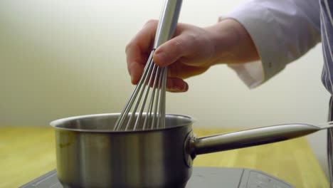 a man is churning in the kitchen