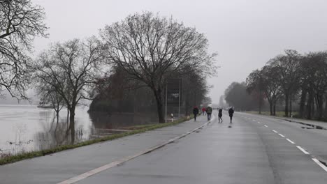 people walks on the empty road of rudesheim, germany on a gloomy day. wide shot