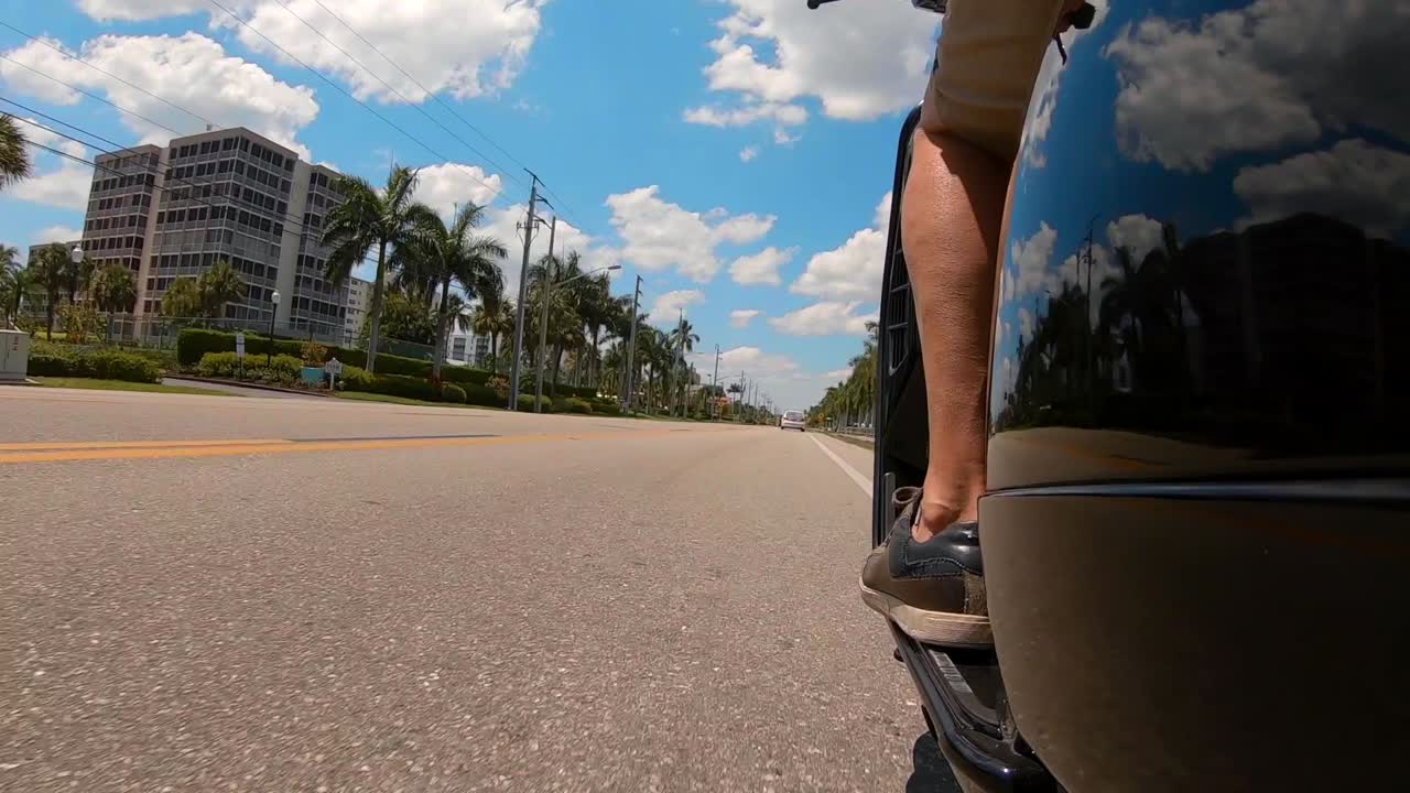 Vespa Scooter Low Angle POV Estero Island Florida Estero Boulevard