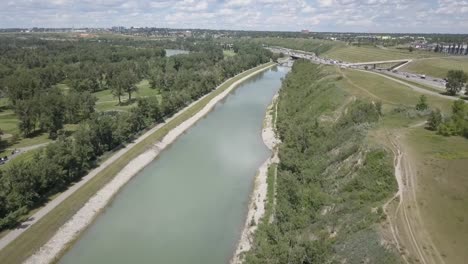 an urban irrigation canal beside the freeway