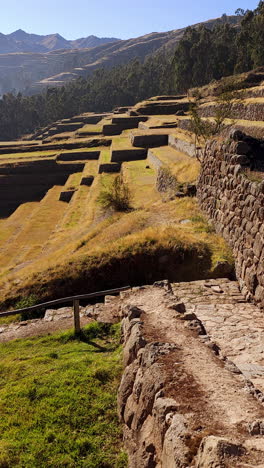 a breathtaking panoramic view of the ancient inca agricultural terraces in chinchero, peru. the impressive engineering of the incas and the stunning andean mountain landscape
