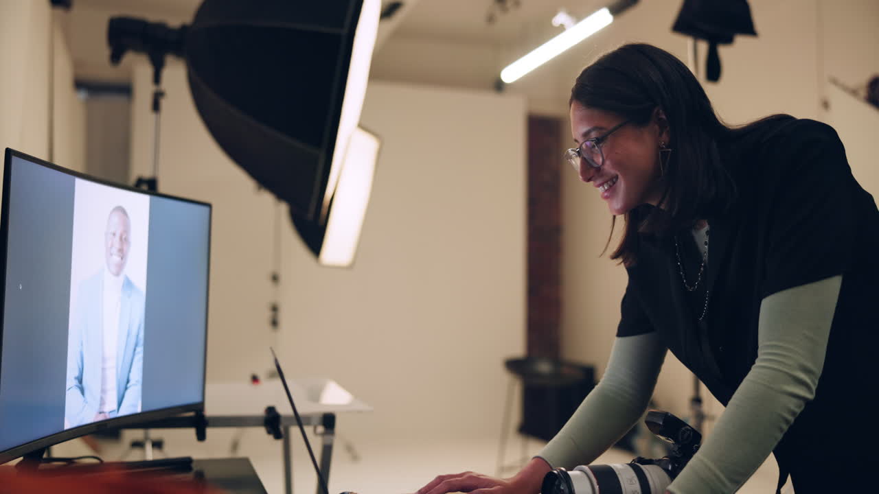 Photographer editing portrait in studio