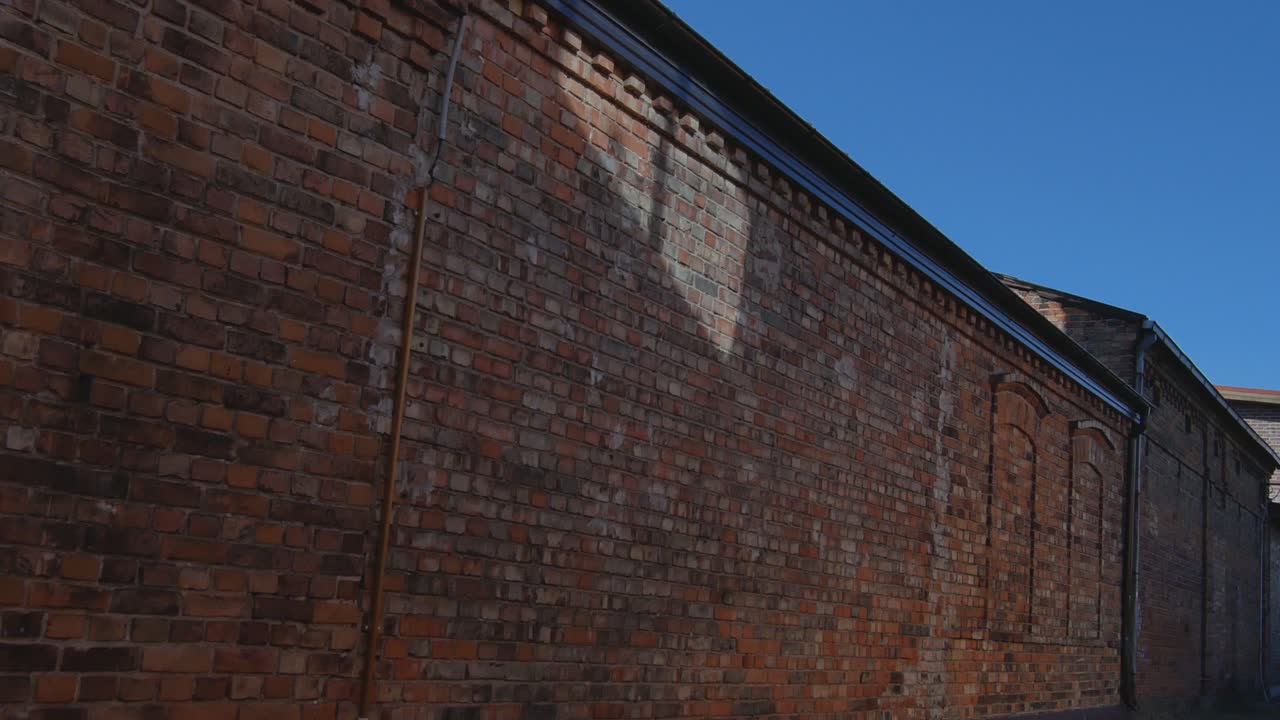 Red Brick Wall Of an Old House. 4K Zoom-In Footage