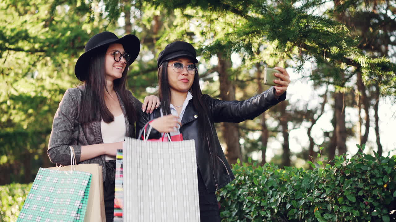 Two Friends Taking a Selfie After Shopping