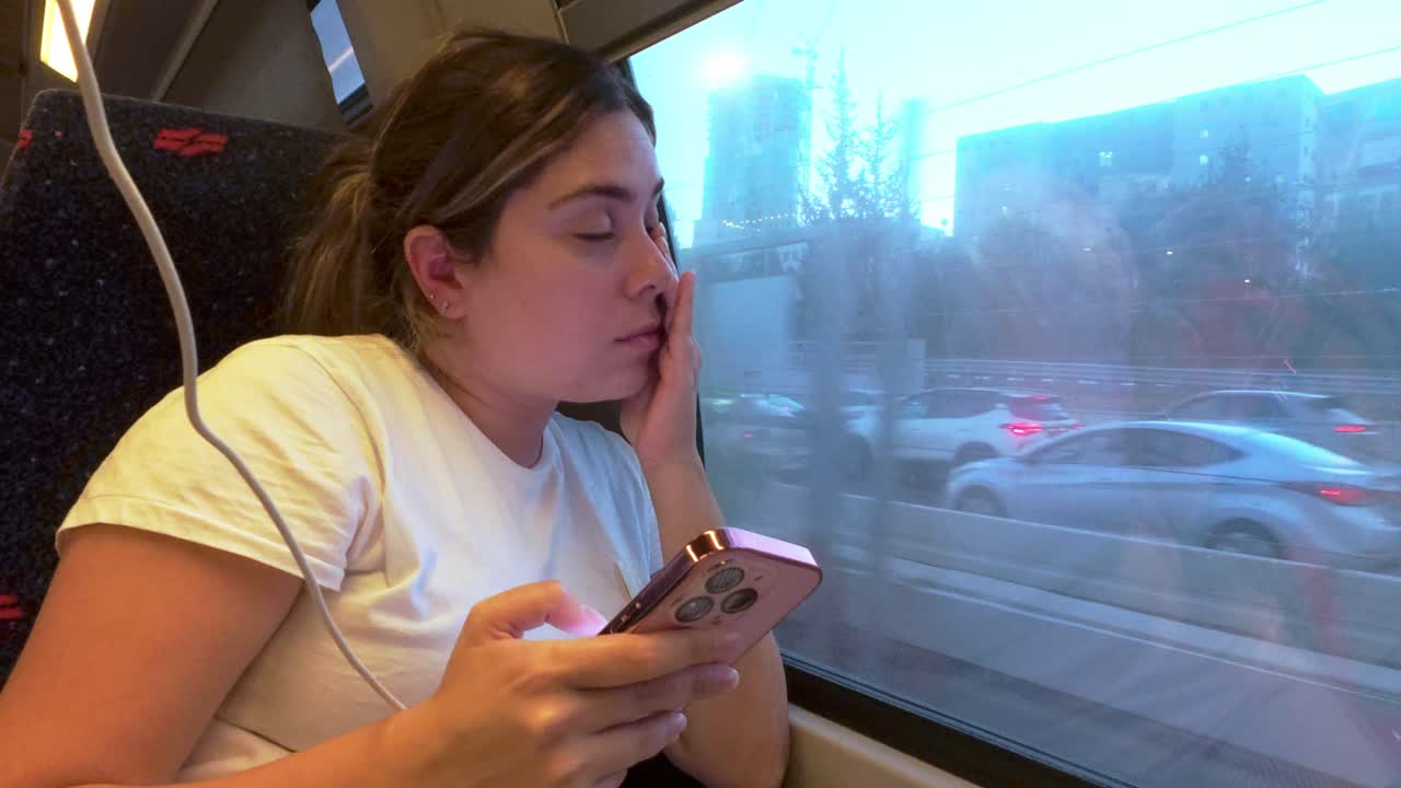 Woman Face Lit by Phone Screen with Reflection in Window