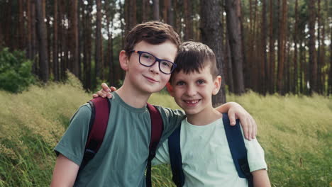 boys hugging at the forest