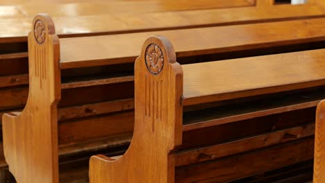 slow track along rows of vintage wooden pews in lutheran church