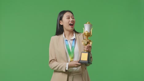 woman celebrating a trophy win