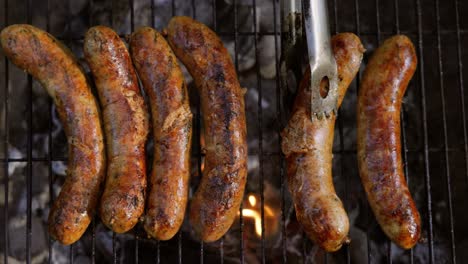 delicious juicy sausages, cooked on the grill with a fire.