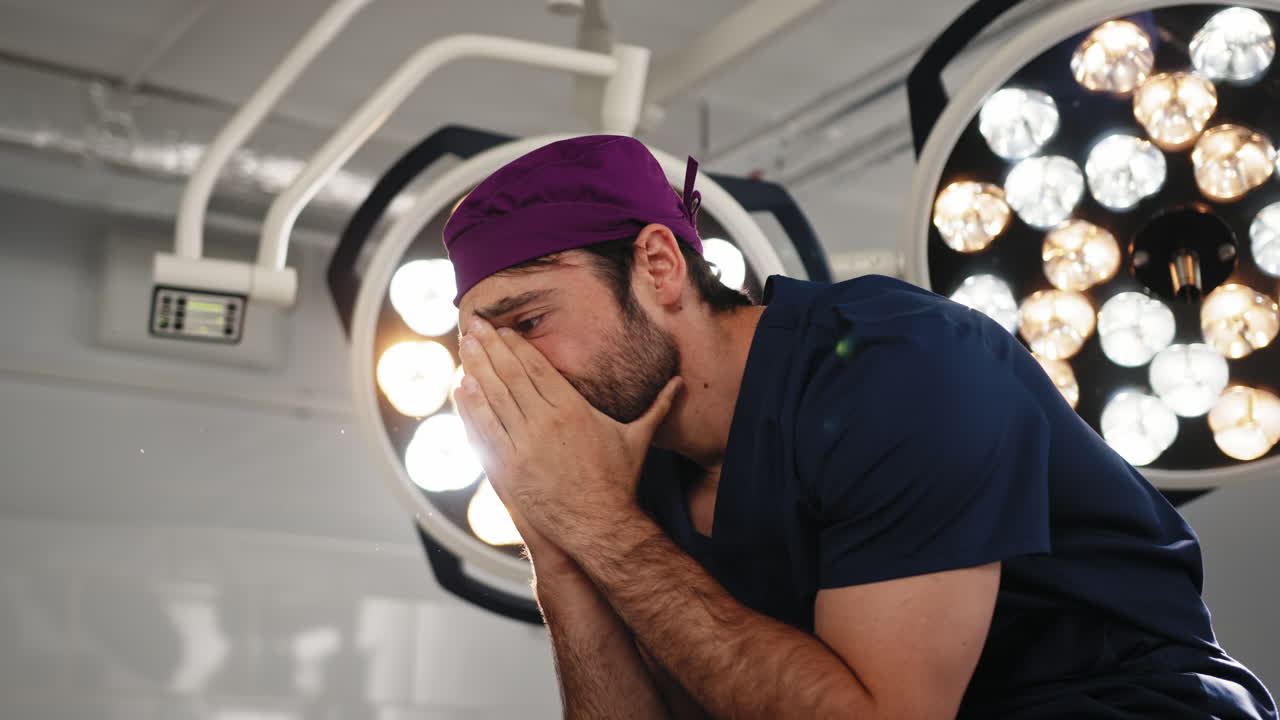 Exhausted surgeon in operating room