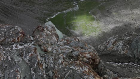 small mountain lake fed by streams during summer season