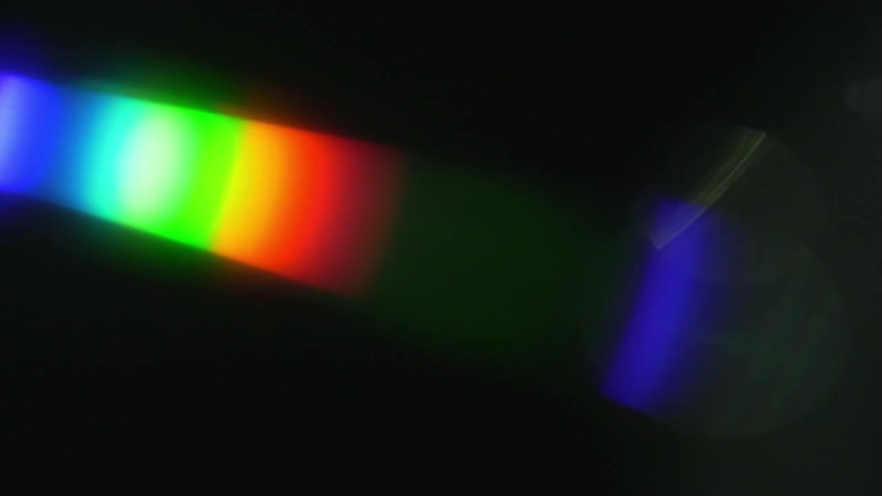 Vibrant Rainbow Lens Flare Effect on Dark Background