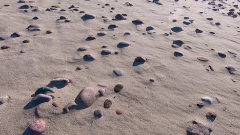 slow motion, coastal pebbles