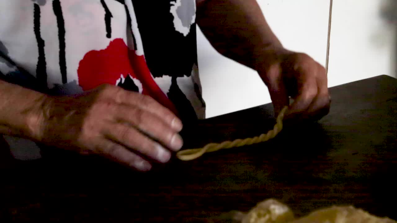 A woman prepares bread and cookies