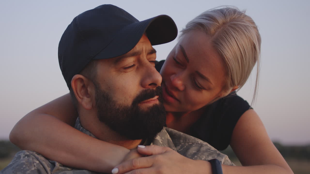 Soldier comforting his wife