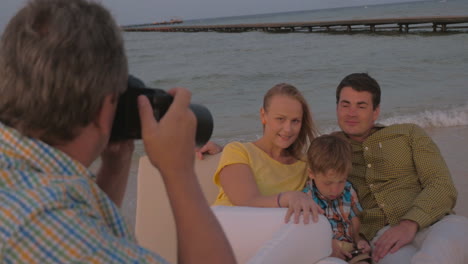 taking pictures of the family on sea shore