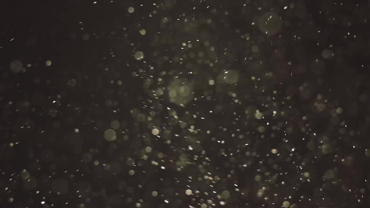 Particelle di polvere su sfondo scuro