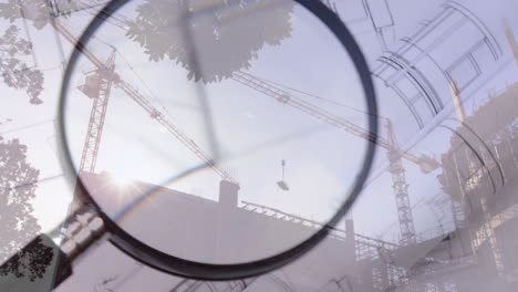 lupa sobre los planos de los edificios