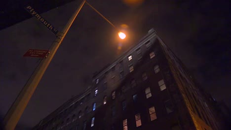 wide low angle shot of a new york or brooklyn apartment complex in a warehouse district at night 2