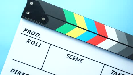 clapperboard on a light blue background