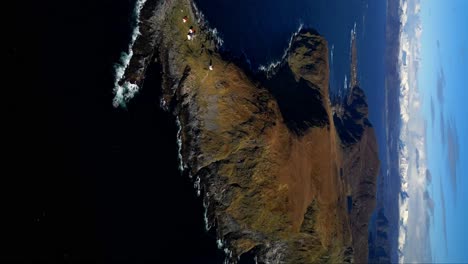 aerial view of a dramatic island coastline with lighthouses
