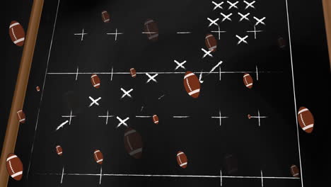 animation of american footballs over tactical game plan on chalkboard