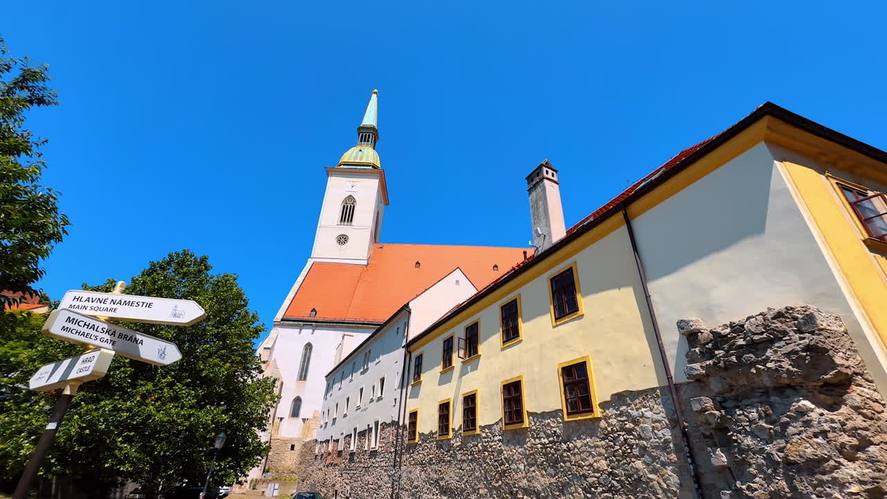 Bratislava, Slovakia, 2 June 2025: Ancient cathedral in the old town of Bratislava, Slovakia. Low angle view at the beautiful church on sunny day