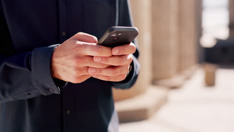 city, smartphone and hands of man typing message