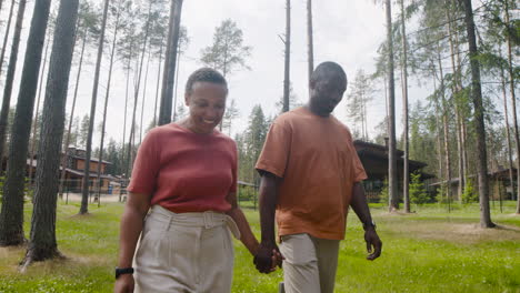 Happy-Couple-Visiting-Man's-Mother-And-Then-They-Embracing-Each-Other-Outside-Home