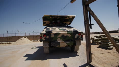 military personnel and vehicle in desert