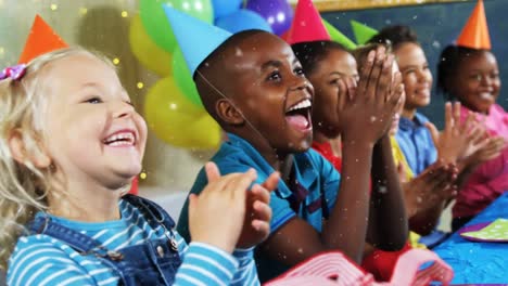 Animación-De-Nieve-Cayendo-Sobre-Diversos-Niños-Con-Gorros-De-Fiesta-En-Una-Fiesta-De-Cumpleaños.