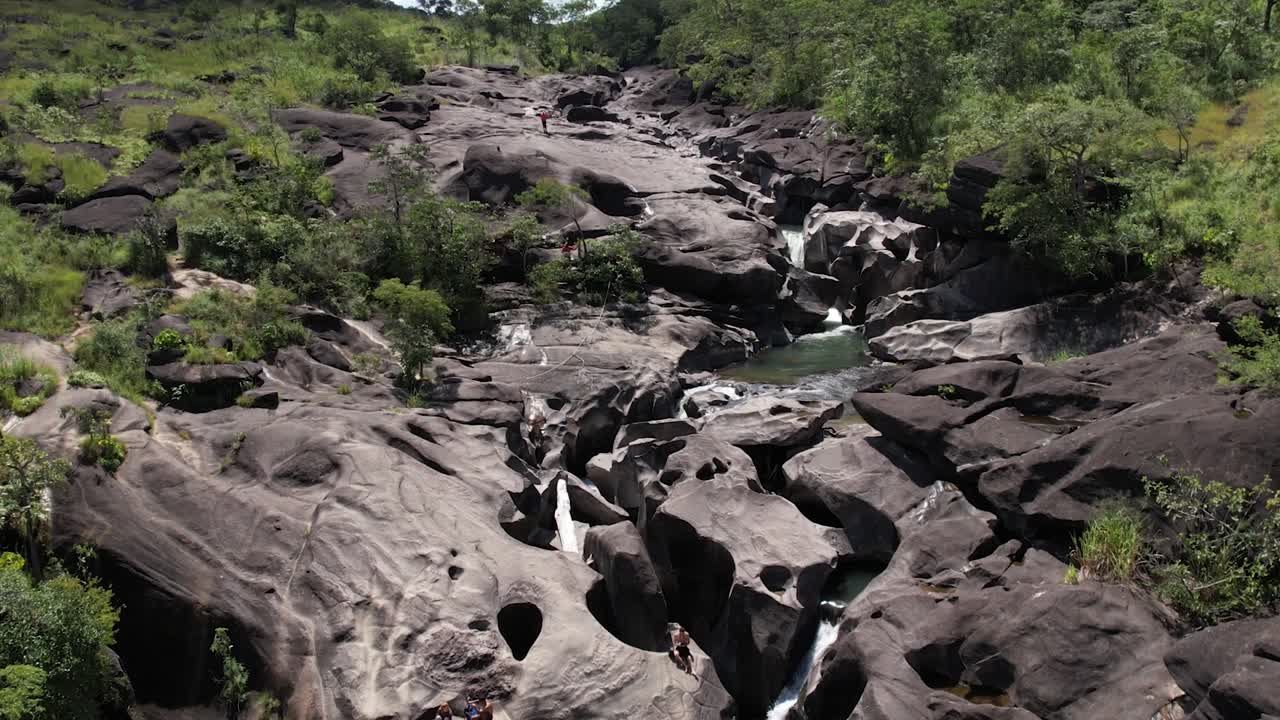 aerial view of Vale da Lua in Chapada dos Veadeiros National Park Goi&aacute;s Brazil sunny day, waterfall, rocks and cerrado vegetation