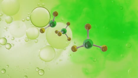 animation of micro of molecules models over green background