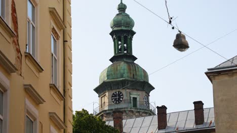 clock tower of the cathedral on a background of the sky - bernardine church, lviv - tilt up shot